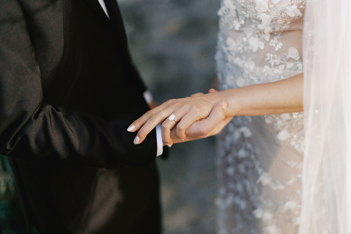 bride and groom holding hands